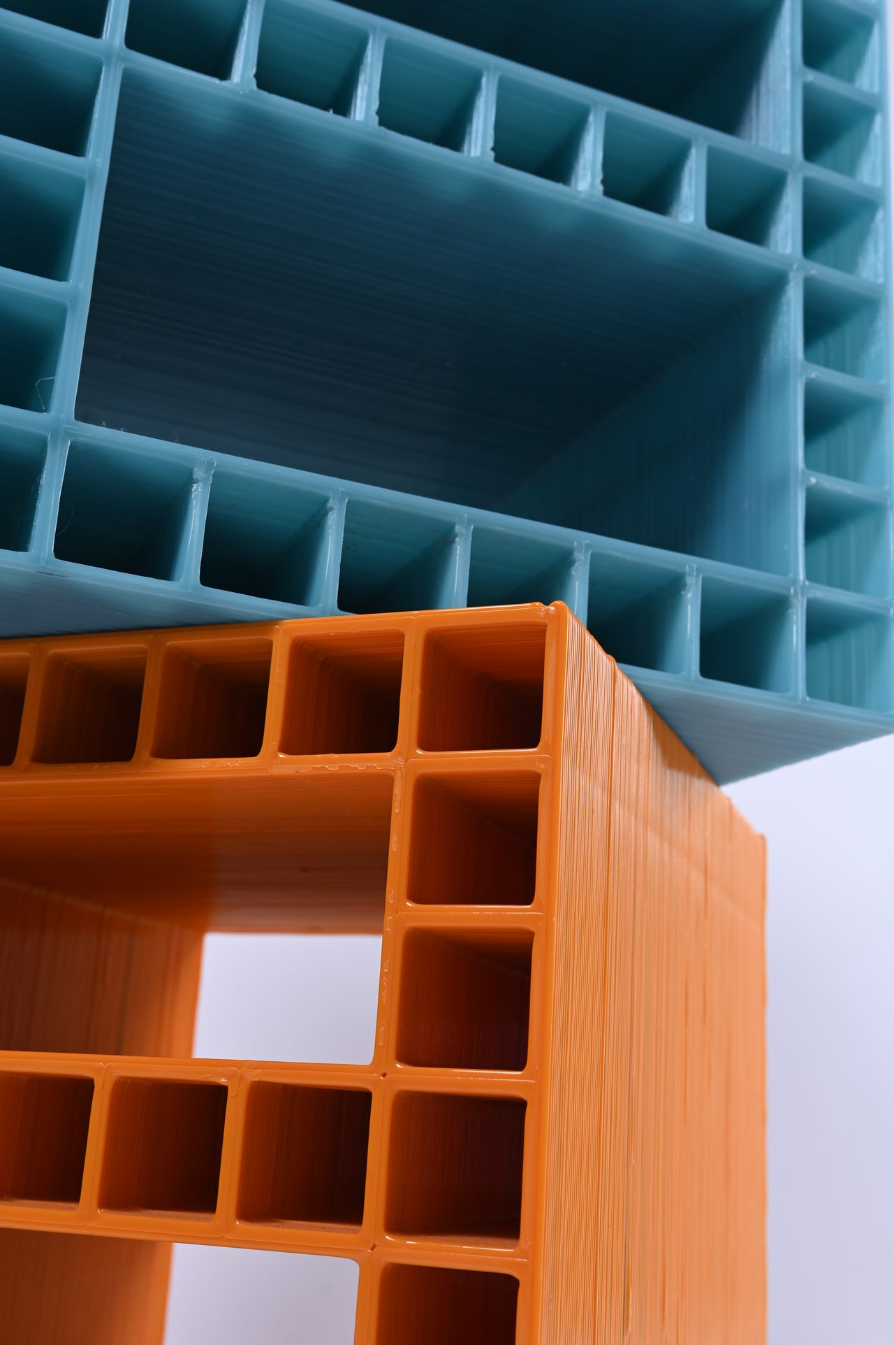 Modulo, teal and orange modules stacked, seen from below