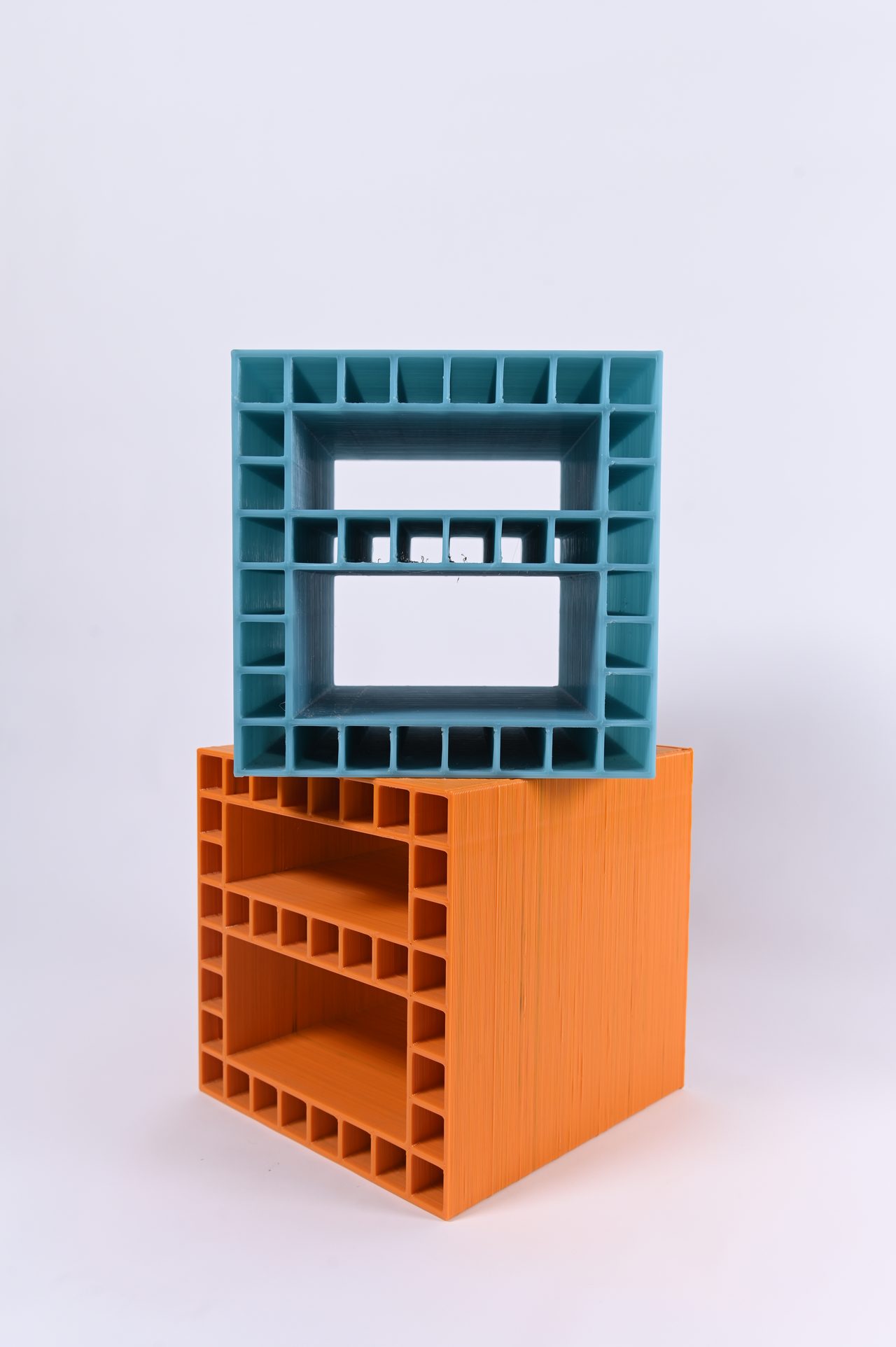 Modulo, teal module stacked on an orange one