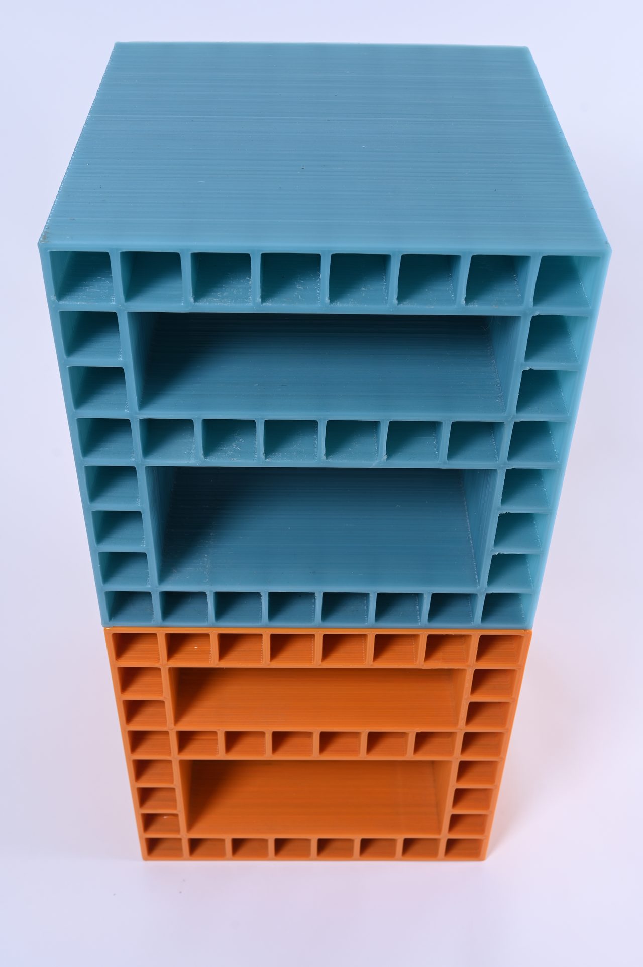 Modulo, teal and orange modules stacked into a column